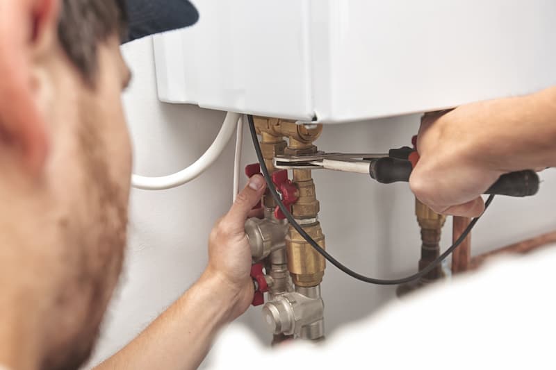 plumber installing boiler